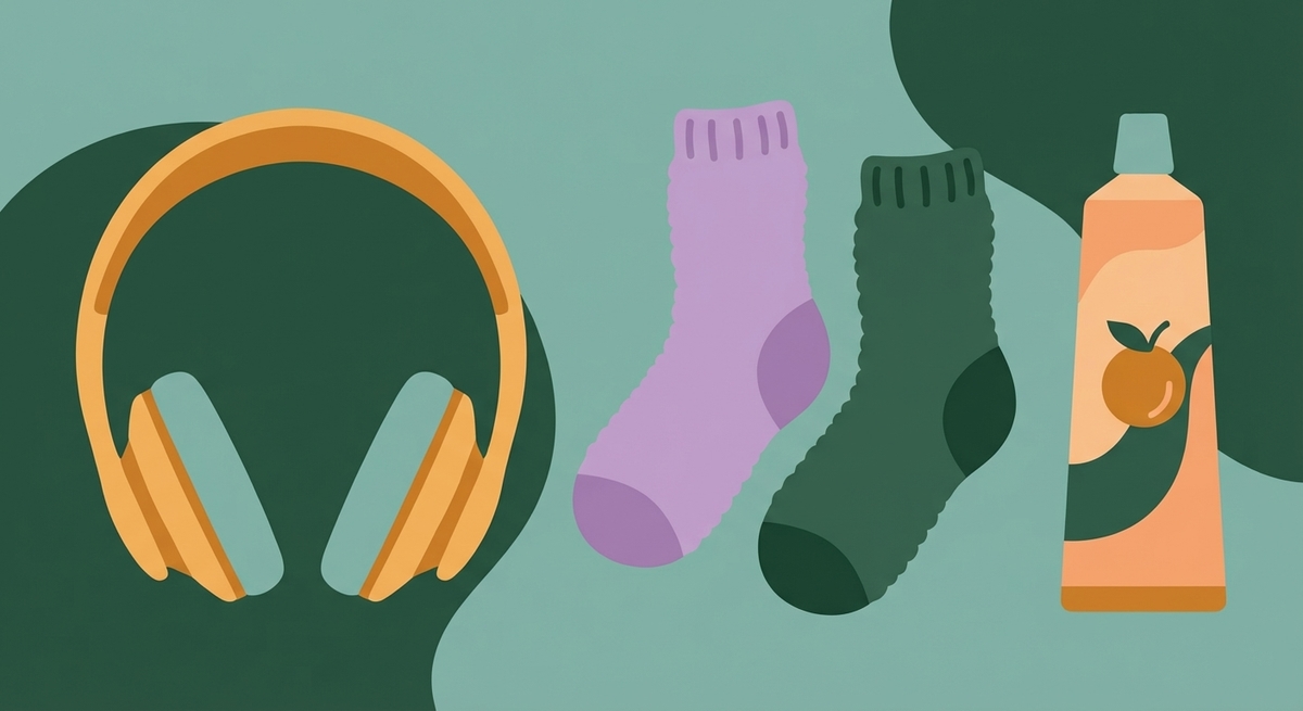 A collection of sensory survival items including noise-canceling headphones, seamless socks, and fruit-flavored toothpaste.